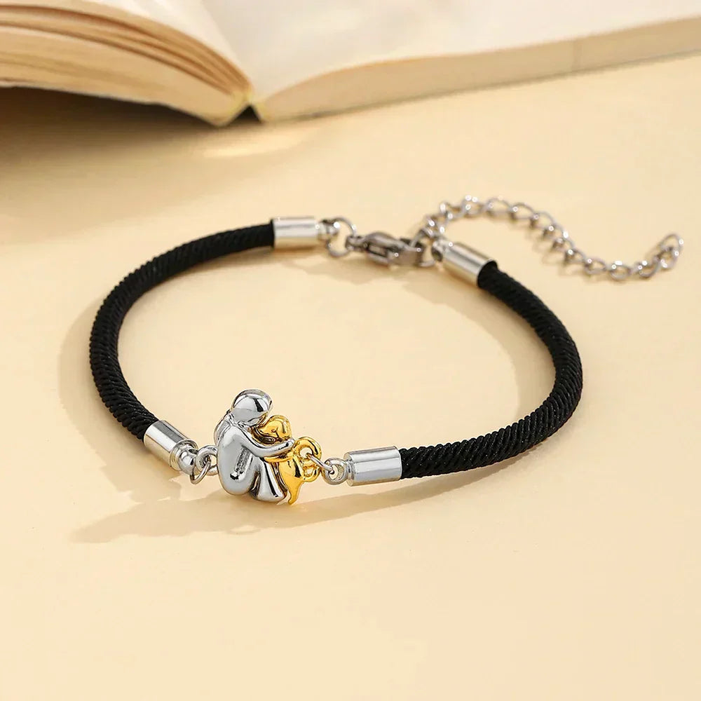 Liora – Bracelet cordon noir avec icône chien